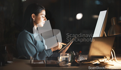 Image of Laptop, computer or business woman on tablet at night in office for research, cloud computing or planning marketing schedule. IT, programmer or developer working overtime review startup cybersecurity