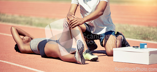 Image of Sports injury, knee pain and medic with first aid to help black woman, athlete and runner during race or marathon. Hands of paramedic man on leg of female for emergency accident medical care