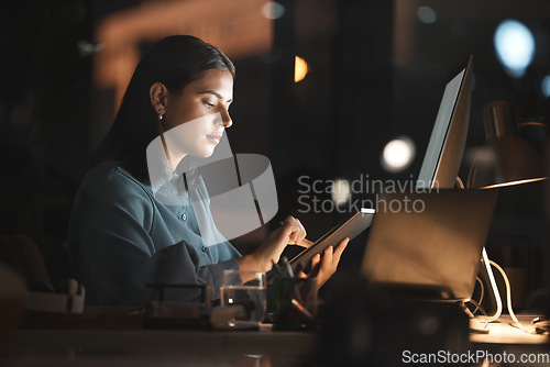 Image of Woman, office and table on internet at night for overtime, working or digital marketing with technology. Professional businesswoman, late and tech for web, email or communication on app in workplace