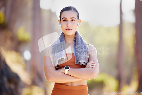 Image of Woman portrait, fitness and serious face outdoor ready for training, exercise and running sport. Wellness, sports health and workout start of a runner athlete in nature with arms crossed