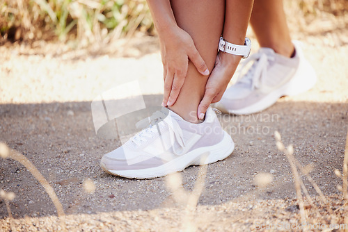 Image of Foot pain, woman and sport injury while training, running and exercise, muscle and problem in nature. Ankle injury, runner and girl with bone, joint and sprain issue during workout or fitness routine