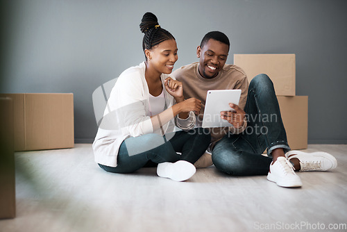 Image of Tablet, box and moving with black couple in new house for planning, real estate and property. Investment, goals and future with man and woman in new home with technology, internet and growth