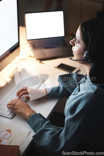 Image of Call center, customer service and communication with a woman consultant working late at night in her office. Crm, contact us and support with a female employee at work in telemarketing or sales