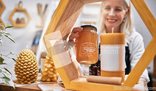 Image of Mature woman, honey shop and shelf order in organic bees product sales, natural medical food or healthy retail stock. Smile, happy and small business store owner with grocery promotion on ingredient