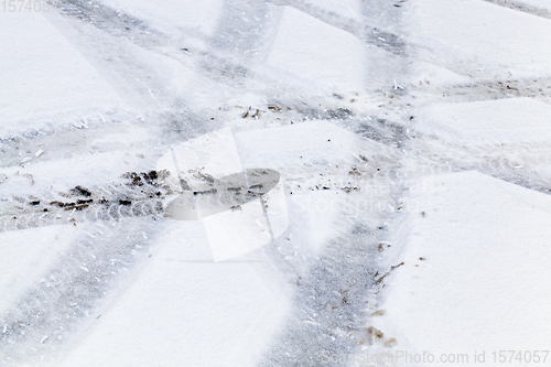 Image of car tire in the snow