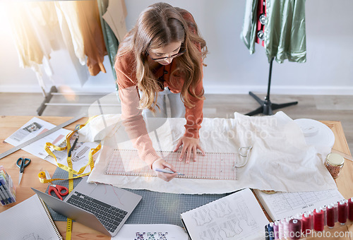 Image of Fashion, designer and fabric woman with sewing tools, measuring tape and laptop for manufacturing, production and retail process. Creative, startup and textile industry worker with clothes pattern