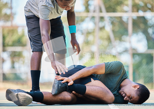 Image of Basketball player, man with injury, ankle pain and sports trauma, fitness emergency and first aid accident or risk and wound. Black man, basketball court and leg pain, muscle inflammation and problem