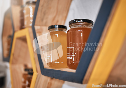 Image of Honey glass container, shop product and retail food sale with modern store packaging and stock. Vegan, sustainable and eco friendly grocery products on discount in a supermarket business or market