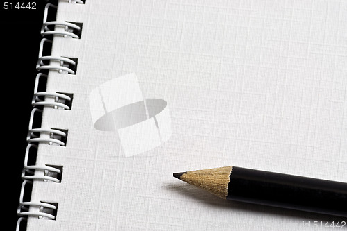 Image of Pencil on notepad