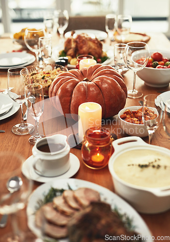 Image of Thanksgiving, festival celebration and food on table ready to eat on holiday, vacation and traditional party. Festive, Christmas and delicious feast with pumpkin, turkey and meat on dinner table