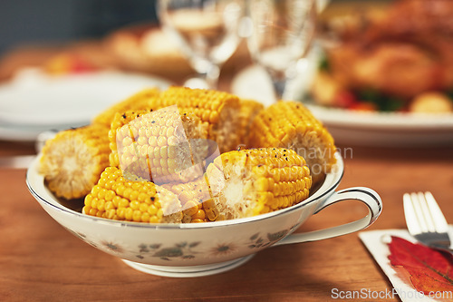 Image of Corn, celebration and dinner on a table for Christmas, lunch and nutrition on holiday. Feast, Thanksgiving and food on a dining table for healthy eating, sharing and celebrate festive with a meal