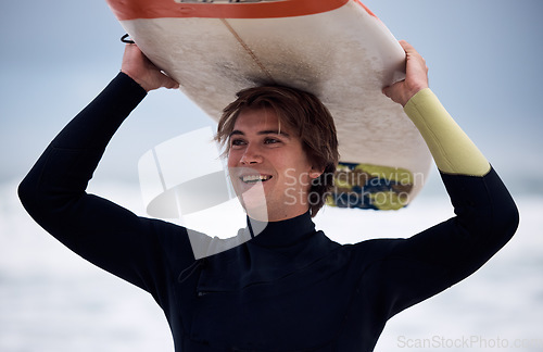 Image of Ocean, surfer and man carrying surfboard on holiday, vacation or summer trip in Hawaii. Fitness, workout and happy male athlete with board after surfing, water sports and training exercise by sea.