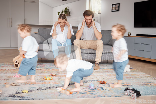 Image of Parents, stress and busy with an adhd child running around a home living room with energy or motion blur. Family children and headache with a hyperactive kid in a lounge with a stressed mom and dad