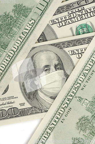 Image of Portrait of Franklin on 100 dollar banknote with medical mask