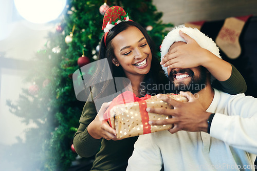 Image of Couple, Christmas gift surprise and holiday celebration, happy together with cover eyes and Christmas tree. Celebrate at home, Mexican man with woman, decoration and present secret with love.