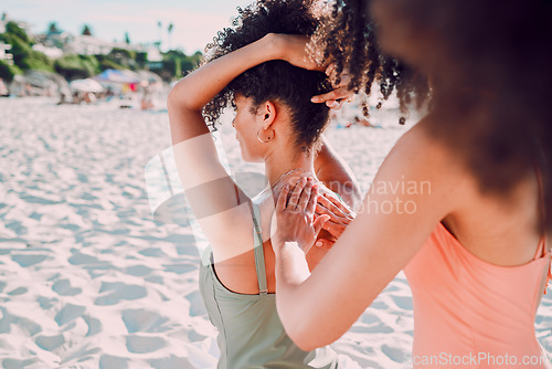 Image of Woman, friends and back sunscreen at the beach for healthy skincare, protection or moisturizer in the outdoors. Hands of female helping friend apply SPF, sunblock or lotion in care for health or skin