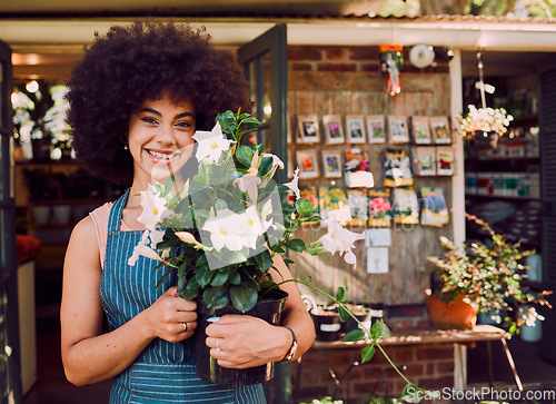 Image of Flowers, small business and black woman in portrait for store, seller and supplier success, growth and natural plants. Floral, sustainable and green shop business owner with entrepreneur spring sale