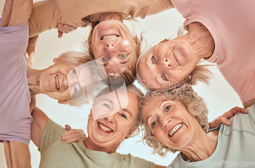 Image of Fitness, happy and elderly friends in a circle for support, trust and team building in a wellness class below view. Partnership, smile and senior women in a huddle with motivation, health or hope