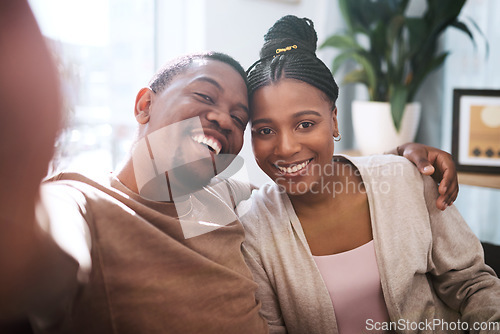 Image of Portrait, black couple and selfie in living room, happy and relax while bonding, embrace and smile in their home. Face, love and man with woman in lounge for photo, enjoy their relationship