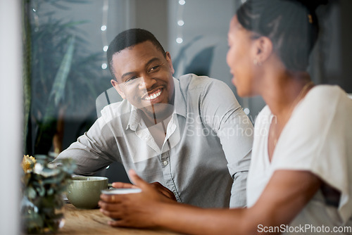 Image of Couple, restaurant and coffee with a man and woman bonding while relax in a cafe for care and love. Boyfriend, girlfriend and bond in a coffeeshop with an espresso for loving, caring relationship