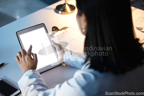 Image of Night business, woman and tablet, screen and website research, iot innovation and data planning at office desk. Female worker using digital app in dark company, technology software and brand strategy