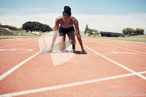 Image of Fitness, running and woman at start line training for marathon race event at stadium. Exercise, sports and motivation for winning, black woman runner from Jamaica ready to run with focus and energy.