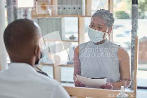 Image of Office, face mask and business people in meeting with regulations during covid pandemic. Social distance, corporate and professional African employees talking with documents or paperwork in workplace