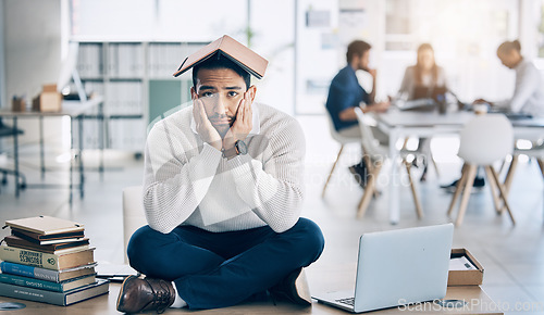 Image of Laptop, books and businessman in training fail, burnout and stress with overwhelm workload in office, depression and tired. Corporate, business and sad man on a table, bored and moody while working