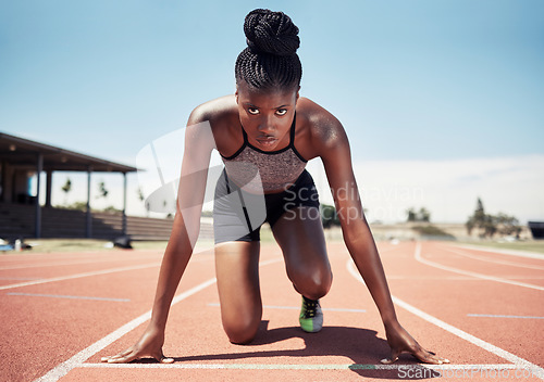 Image of Black woman, runner and start line, race and competition, exercise challenge or fitness at stadium arena. Portrait, focus and sports athlete ready on running track, marathon training and cardio power