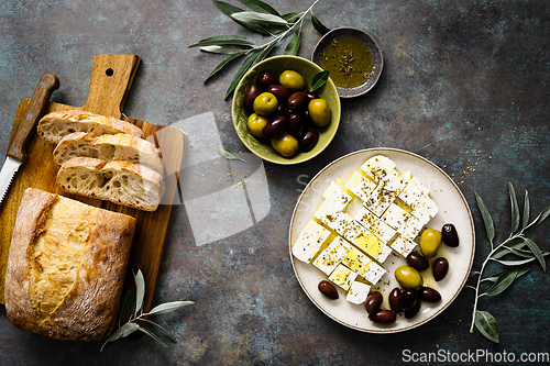 Image of Feta cheese, olives and ciabatta, top view