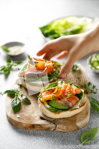 Image of Salmon sandwiches with cream cheese, fresh romaine lettuce and cucumber