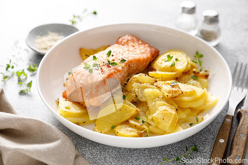 Image of Salmon grilled and baked potato with onions