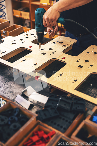Image of Worker's hands on a workbench