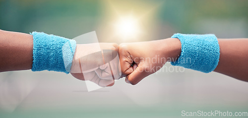 Image of Tennis, closeup and fist bump for success, motivation and teamwork with blurred background while outdoor. Tennis player, hands and touch for respect, team building and support at training in summer