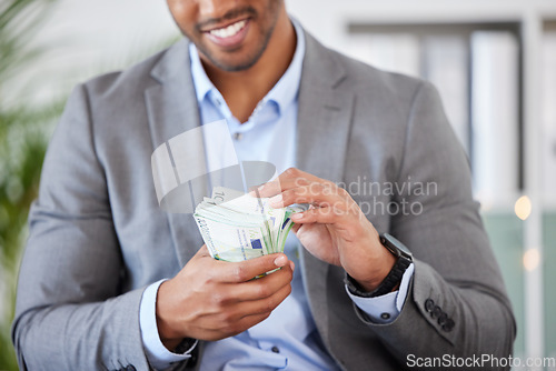 Image of Hands, money and finance with a business man counting cash while accounting or banking in his office. Financial, investment and loan with a male employee working as an economy accountant for profit
