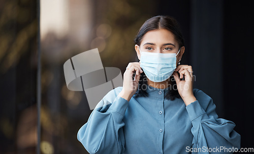 Image of Face mask, woman and covid business worker in an office with health and corona virus safety. Company employee doing covid 19 healthy security policy in the workplace ready for office working