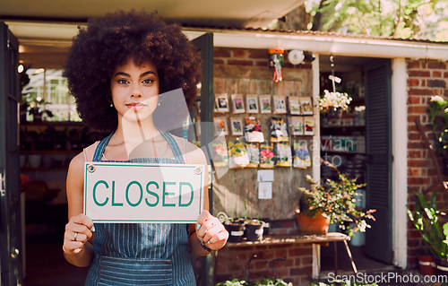 Image of Closed sign, black woman and business failure for cafe, employee and worker with end of day. African American girl, female entrepreneur and owner holding poster for bankrupt store, company closure.