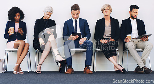 Image of Tablet, phone and recruitment people row with young, senior and corporate candidates in work lobby. Social media, email and online communication of group in chair queue at professional job interview.