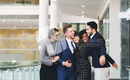 Image of Hug, support and business people excited about success, partnership and giving motivation. Smile, collaboration and corporate friends hugging after an achievement, win or promotion at an agency