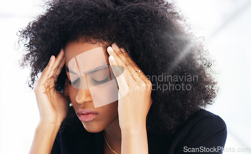Image of Headache, stress and burnout with a business black woman struggling with mental health issues while working in her office. Compliance, face and pain with a female employee suffering from a migraine