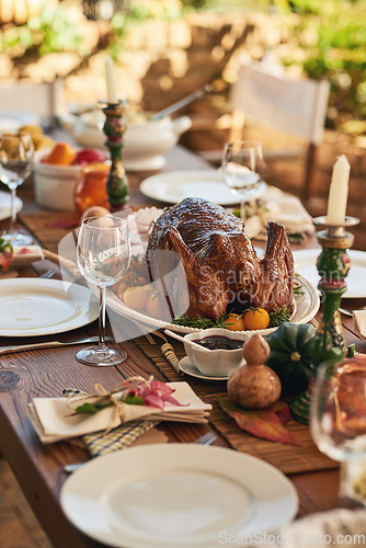 Image of Thanksgiving, food and turkey table for gratitude, thanks and grace holiday lunch outside. Roast, vacation and festive outdoor dining meal with colorful decoration for USA celebration.