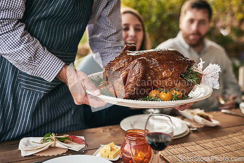 Image of Thanksgiving, table and roast meat at party for dinner, lunch or supper at an outdoor event. Christmas, gathering and chef serving people a luxury meal or feast for festive xmas holiday dining party.