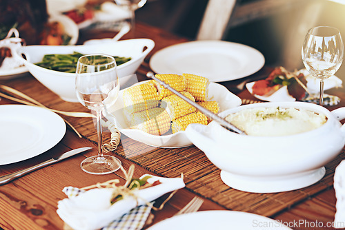 Image of Table, food and vegetables for dinner and party to celebrate Christmas, Thanksgiving or anniversary. Feast, holiday and celebration with table setting, meal for dinner party and vegetable dish.