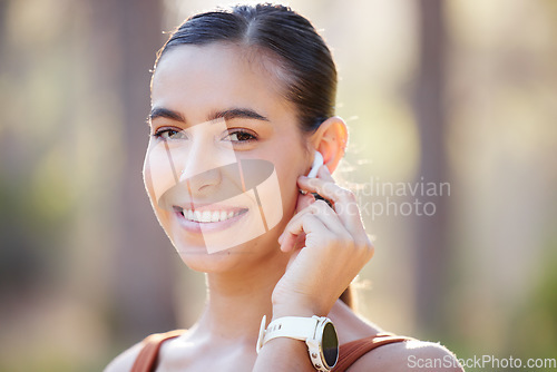 Image of Fitness, woman and portrait smile for EarPods, music listening or wireless technology during running exercise. Active happy female smiling with teeth for earphones, healthy cardio and audio streaming