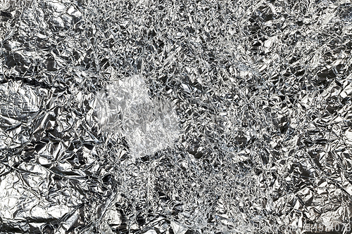 Image of thin and crumpled shiny aluminum foil,