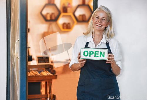 Image of Restaurant, cafe and woman with open sign, senior waiter at local coffee shop and small business ready for business. Hospitality, elderly Canada waitress and manager with happy smile greeting you