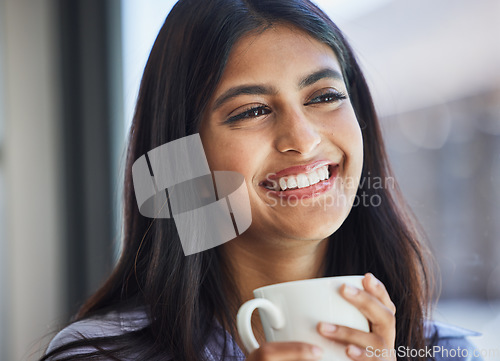 Image of Woman, smile and mug for coffee in home for thinking, relax or vision by lounge, window or room. Girl, happy and drinking cup for beverage, tea or coco in living room, house or apartment for daydream