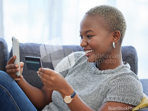 Image of Ecommerce, phone and happy black woman with a credit card online shopping on a digital payment app at home. Smile, banking and excited African girl checks cash budget, money growth or savings online