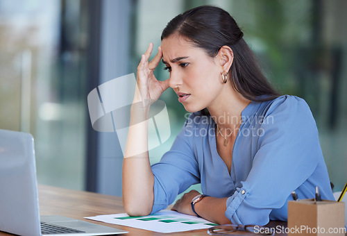 Image of Business woman, laptop and stress with headache from work anxiety or technical problems at the office. Female employee analyst suffering from burnout, depression or mental health issues at workplace