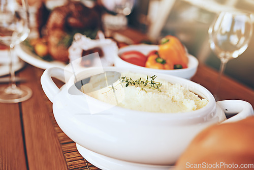 Image of Food, table and dinner with party to celebrate holiday or anniversary with mashed potato closeup and nutrition. Healthy meal, feast for Christmas or Thanksgiving with celebration and vegetable zoom.